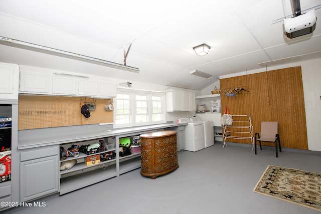 7 Saddle Pl, Pinehurst, NC 28374 - garage featuring washer and dryer, a garage door opener, and wooden walls