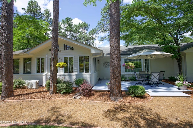 7 Saddle Pl, Pinehurst, NC 28374 - view of front facade featuring a patio and brick siding