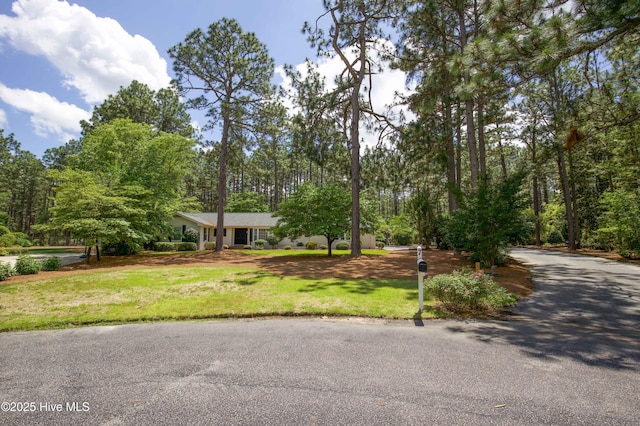 7 Saddle Pl, Pinehurst, NC 28374 - ranch-style home with a front lawn and driveway