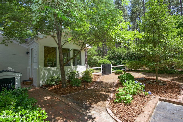 7 Saddle Pl, Pinehurst, NC 28374 - view of yard featuring a sunroom