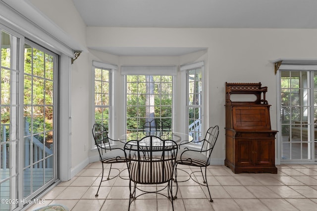 3665 Willow Lake Dr SE, Southport, NC 28461 - sunroom with french doors, tile patterned flooring, and baseboards