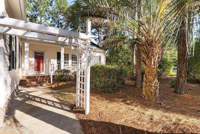 3665 Willow Lake Dr SE, Southport, NC 28461 - view of exterior entry with covered porch
