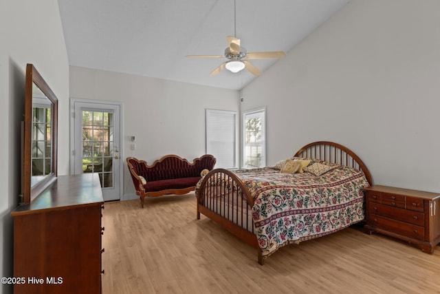 3665 Willow Lake Dr SE, Southport, NC 28461 - bedroom featuring access to outside, light wood finished floors, lofted ceiling, and ceiling fan