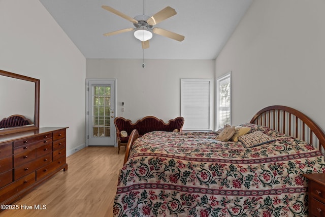 3665 Willow Lake Dr SE, Southport, NC 28461 - bedroom with light wood-type flooring, access to exterior, lofted ceiling, ceiling fan, and baseboards