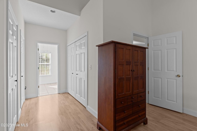 3665 Willow Lake Dr SE, Southport, NC 28461 - hallway with light wood-type flooring and baseboards
