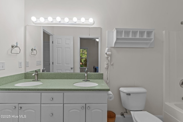 3665 Willow Lake Dr SE, Southport, NC 28461 - bathroom featuring double vanity, toilet, and bathing tub / shower combination