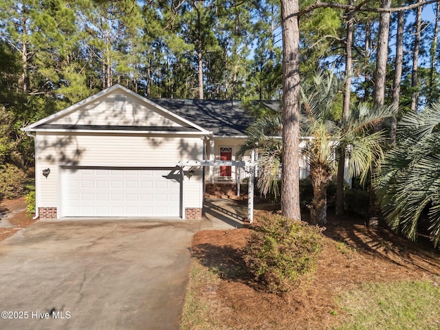 3665 Willow Lake Dr SE, Southport, NC 28461 - view of front of home featuring concrete driveway and a garage