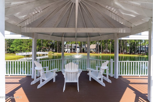 3665 Willow Lake Dr SE, Southport, NC 28461 - view of patio with a deck with water view and a gazebo