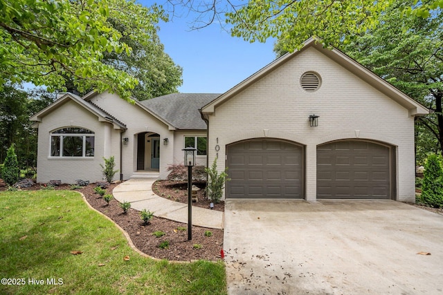 101 Marshview Rd, Hampstead, NC 28443 - view of front of property with brick siding, concrete driveway, an attached garage, and a front yard