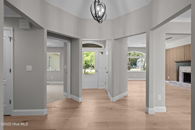 101 Marshview Rd, Hampstead, NC 28443 - foyer with light wood finished floors, a fireplace, and baseboards