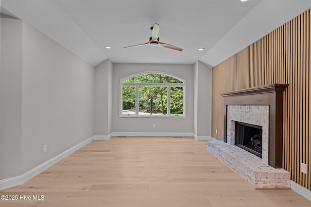 101 Marshview Rd, Hampstead, NC 28443 - unfurnished living room with vaulted ceiling, a ceiling fan, a fireplace, light wood-style floors, and recessed lighting
