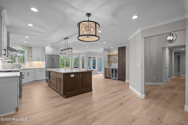 101 Marshview Rd, Hampstead, NC 28443 - kitchen featuring a chandelier, wine cooler, appliances with stainless steel finishes, light countertops, and recessed lighting
