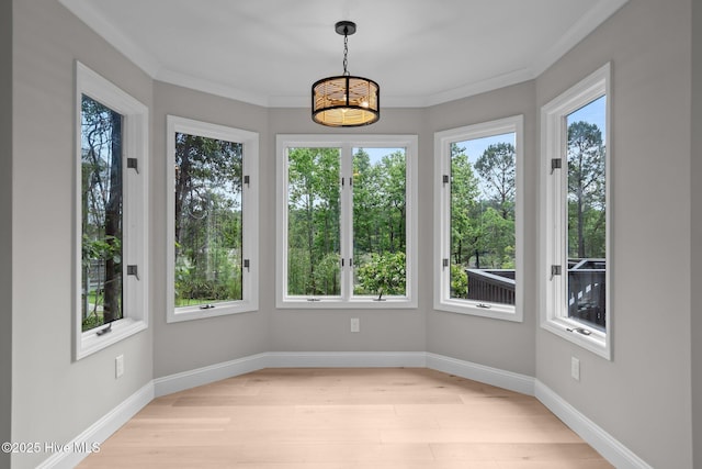 101 Marshview Rd, Hampstead, NC 28443 - unfurnished sunroom featuring wood finished floors, a chandelier, baseboards, ornamental molding, and french doors