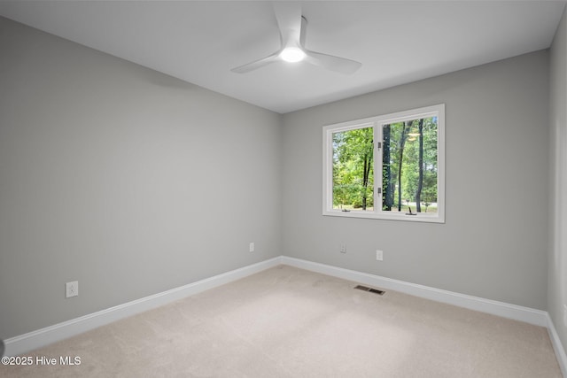 101 Marshview Rd, Hampstead, NC 28443 - spare room with a ceiling fan, baseboards, and light colored carpet