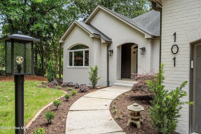 101 Marshview Rd, Hampstead, NC 28443 - view of front of home featuring brick siding and roof with shingles
