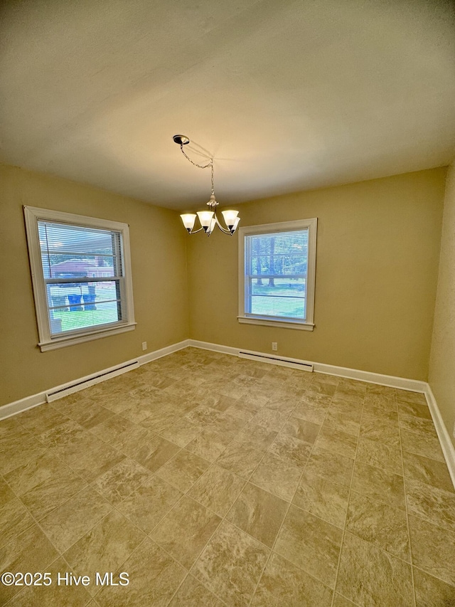 1305 Westwood Ave W, Wilson, NC 27893 - empty room featuring a baseboard heating unit, a chandelier, and baseboards