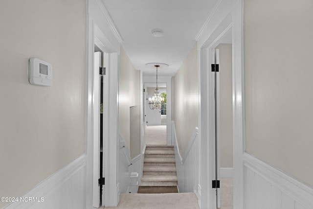 107 Rockingham Rd, Rockingham, NC 28379 - hall with a chandelier, a decorative wall, and a wainscoted wall