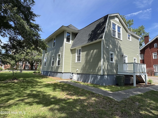 107 Rockingham Rd, Rockingham, NC 28379 - view of side of property with a yard, a deck, a shingled roof, and stairs