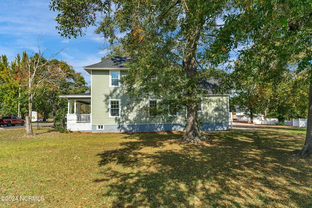 107 Rockingham Rd, Rockingham, NC 28379 - rear view of house with a lawn