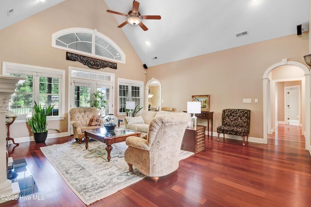 207 Hooping Crane Ln, Goldsboro, NC 27530 - living room with arched walkways, high vaulted ceiling, a ceiling fan, wood finished floors, and ornate columns