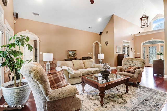 207 Hooping Crane Ln, Goldsboro, NC 27530 - living area with arched walkways, high vaulted ceiling, wood finished floors, and baseboards