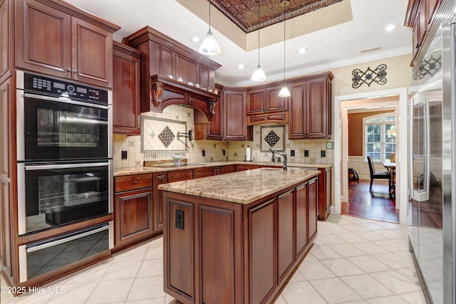 207 Hooping Crane Ln, Goldsboro, NC 27530 - kitchen featuring double wall oven, high end fridge, light tile patterned floors, ornamental molding, and black electric stovetop