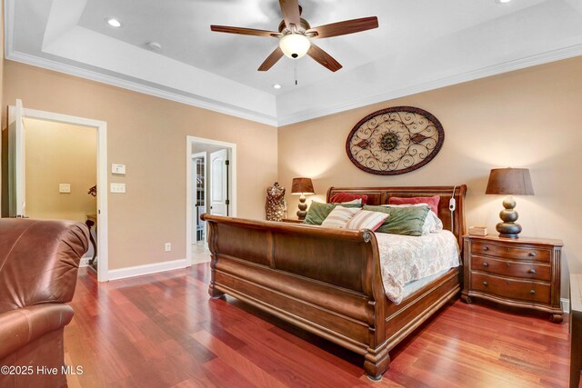 207 Hooping Crane Ln, Goldsboro, NC 27530 - bedroom with a raised ceiling, wood finished floors, baseboards, recessed lighting, and a ceiling fan