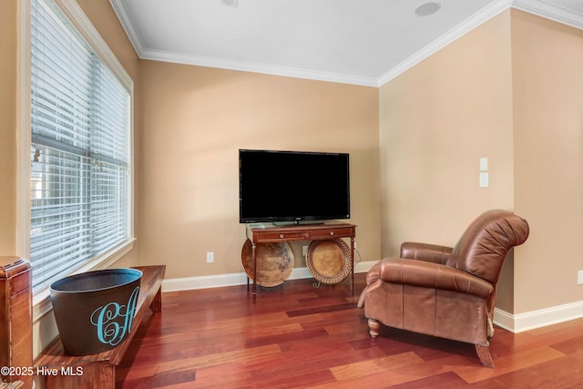 207 Hooping Crane Ln, Goldsboro, NC 27530 - living area featuring wood finished floors, baseboards, and crown molding