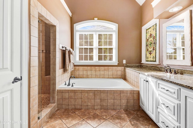 207 Hooping Crane Ln, Goldsboro, NC 27530 - full bath with a tile shower, vanity, a bath, and tile patterned flooring