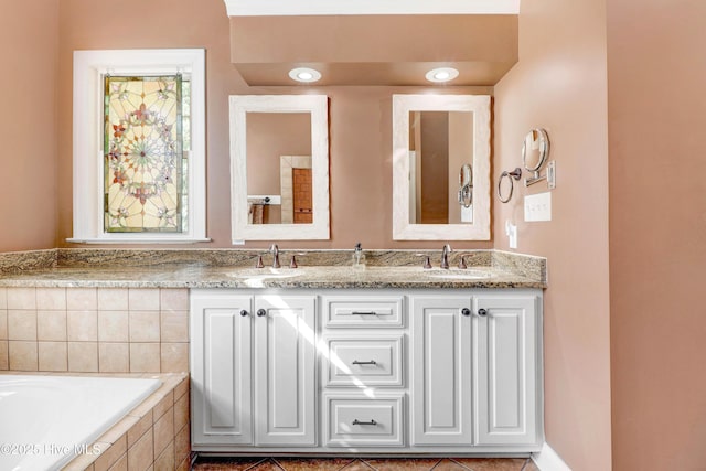 207 Hooping Crane Ln, Goldsboro, NC 27530 - full bathroom with double vanity and tiled tub