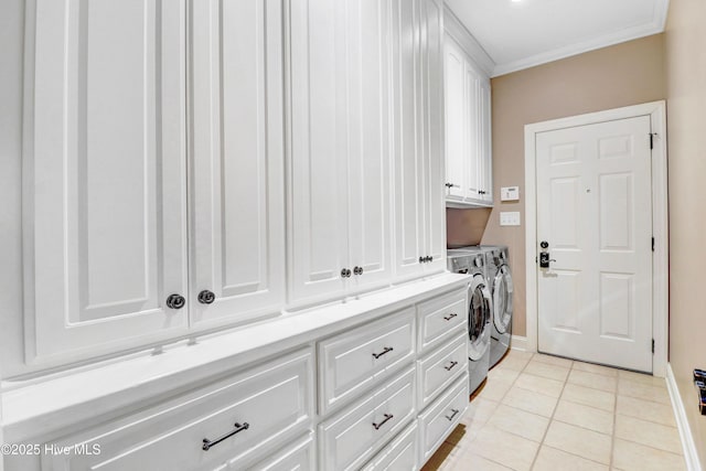 207 Hooping Crane Ln, Goldsboro, NC 27530 - washroom with washer and dryer, cabinet space, light tile patterned floors, baseboards, and crown molding