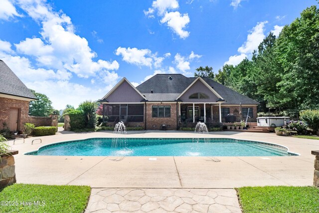 207 Hooping Crane Ln, Goldsboro, NC 27530 - swimming pool with a patio and a sunroom