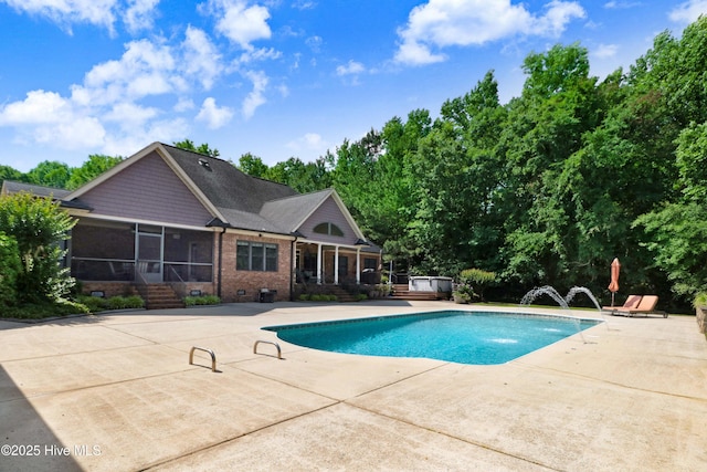 207 Hooping Crane Ln, Goldsboro, NC 27530 - swimming pool with a sunroom, a patio area, and a jacuzzi