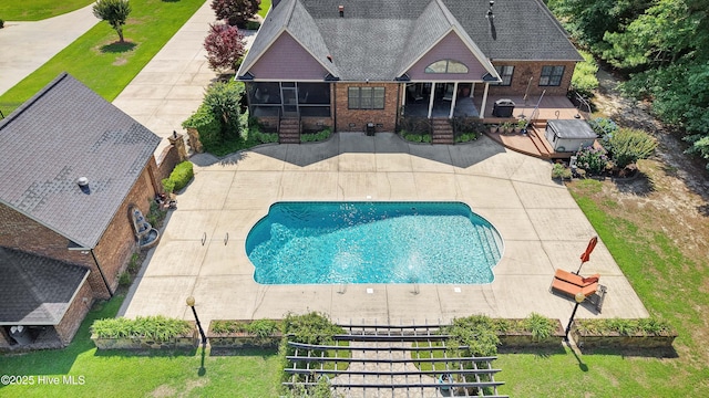 207 Hooping Crane Ln, Goldsboro, NC 27530 - view of swimming pool featuring a patio and a sunroom