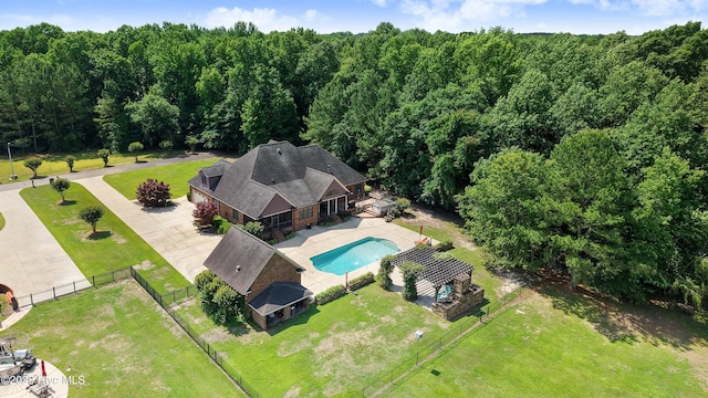 207 Hooping Crane Ln, Goldsboro, NC 27530 - aerial view of property and surrounding area with a pool and a heavily wooded area