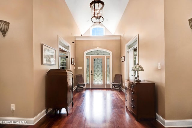 207 Hooping Crane Ln, Goldsboro, NC 27530 - entrance foyer featuring high vaulted ceiling, baseboards, dark wood-type flooring, and a chandelier