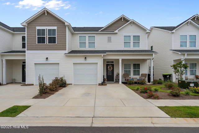 5021 Northstar Dr, Leland, NC 28451 - view of front facade featuring concrete driveway, a porch, a garage, and a shingled roof
