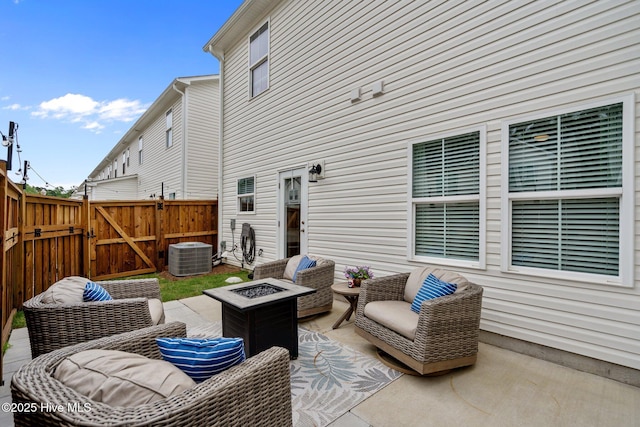5021 Northstar Dr, Leland, NC 28451 - view of patio with a gate, central AC unit, and an outdoor fire pit