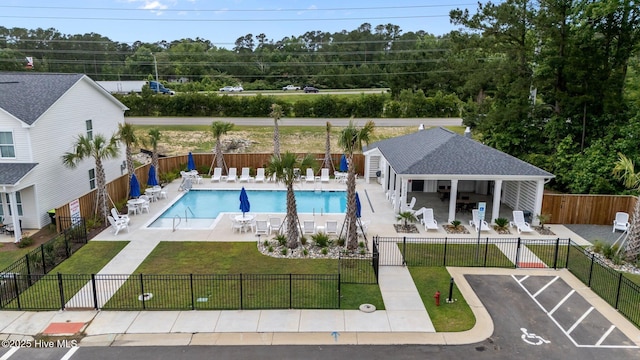 5021 Northstar Dr, Leland, NC 28451 - community pool featuring a patio