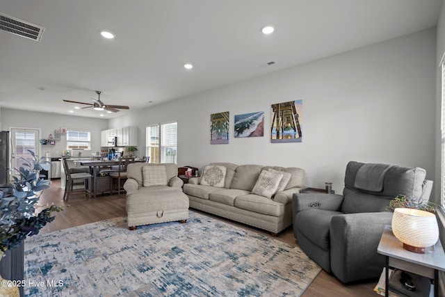 5021 Northstar Dr, Leland, NC 28451 - living room featuring wood finished floors, a ceiling fan, and recessed lighting