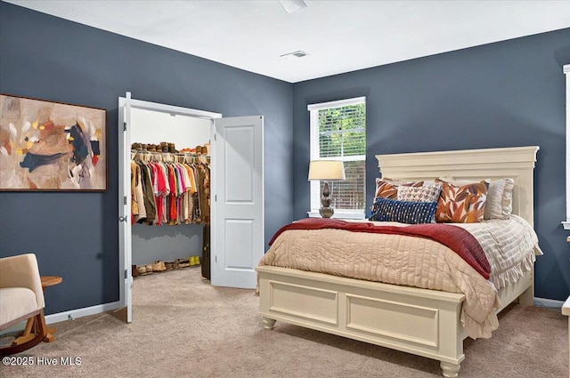 1114 Treyburn Ct NW, Calabash, NC 28467 - bedroom with light carpet, a walk in closet, a closet, and baseboards
