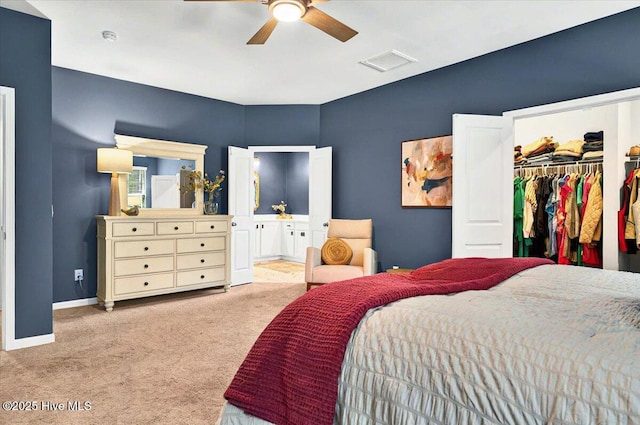 1114 Treyburn Ct NW, Calabash, NC 28467 - carpeted bedroom with a spacious closet, a closet, baseboards, connected bathroom, and a ceiling fan