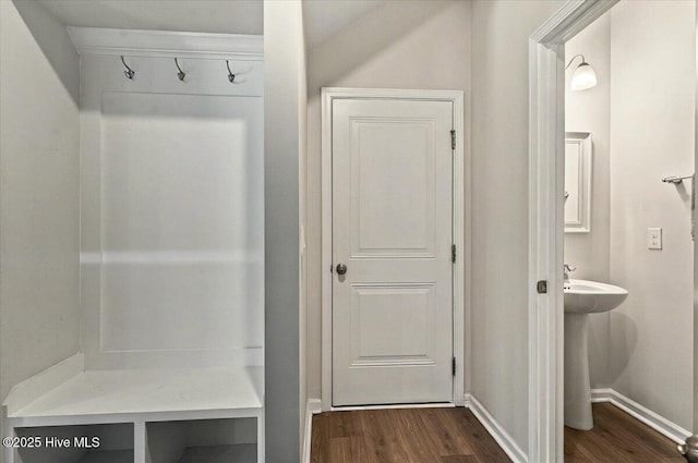 1114 Treyburn Ct NW, Calabash, NC 28467 - mudroom with dark wood-style flooring and baseboards