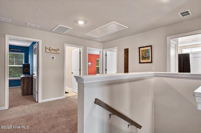 1114 Treyburn Ct NW, Calabash, NC 28467 - hall with attic access, light colored carpet, baseboards, and an upstairs landing