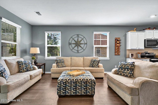 1114 Treyburn Ct NW, Calabash, NC 28467 - living room featuring dark wood-style floors, plenty of natural light, baseboards, and recessed lighting
