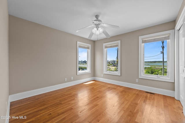 905 N Anderson Blvd, Topsail Beach, NC 28445 - empty room featuring baseboards, light wood finished floors, and a ceiling fan