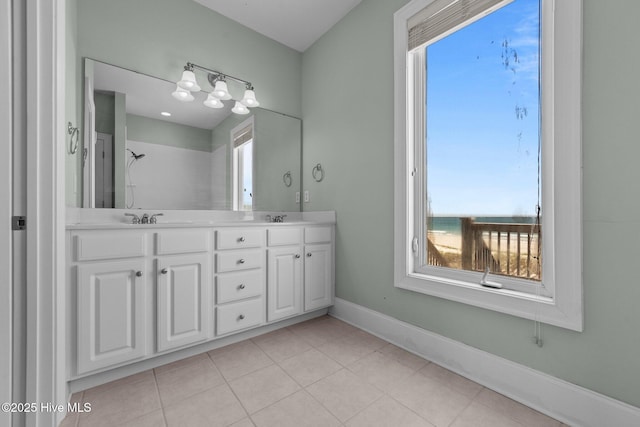 905 N Anderson Blvd, Topsail Beach, NC 28445 - full bath featuring double vanity, baseboards, and tile patterned flooring