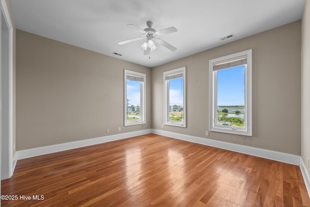 905 N Anderson Blvd, Topsail Beach, NC 28445 - spare room with light wood-style floors, baseboards, and ceiling fan