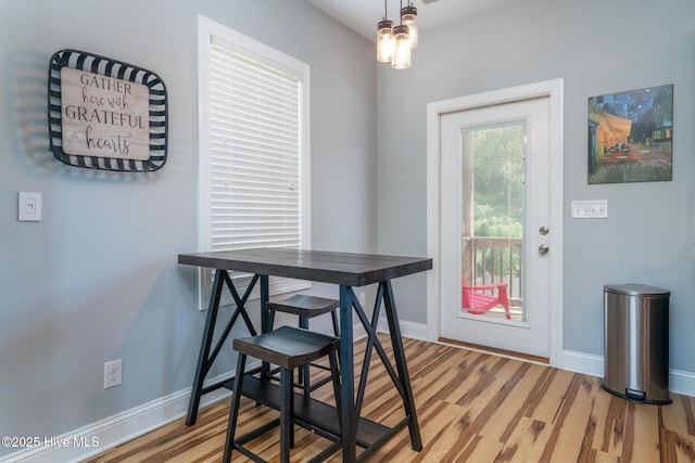 106 NW 8th St, Oak Island, NC 28465 - dining room featuring light wood finished floors and baseboards