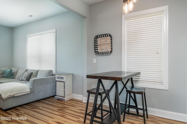 106 NW 8th St, Oak Island, NC 28465 - living area with baseboards and light wood-style flooring